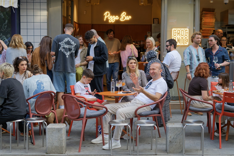 A bustling outdoor terrace of a restaurant